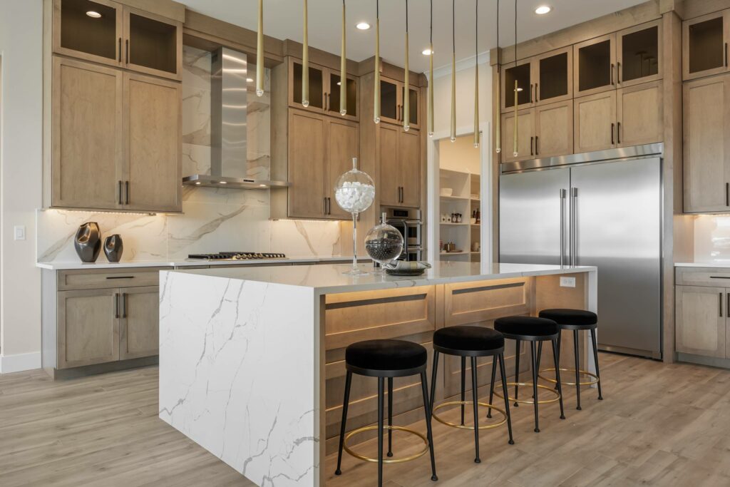 a luxury kitchen with an island by custom home builder in Kennewick Prodigy Homes